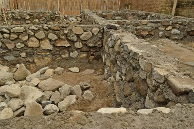 Stone foundation of flood relief house